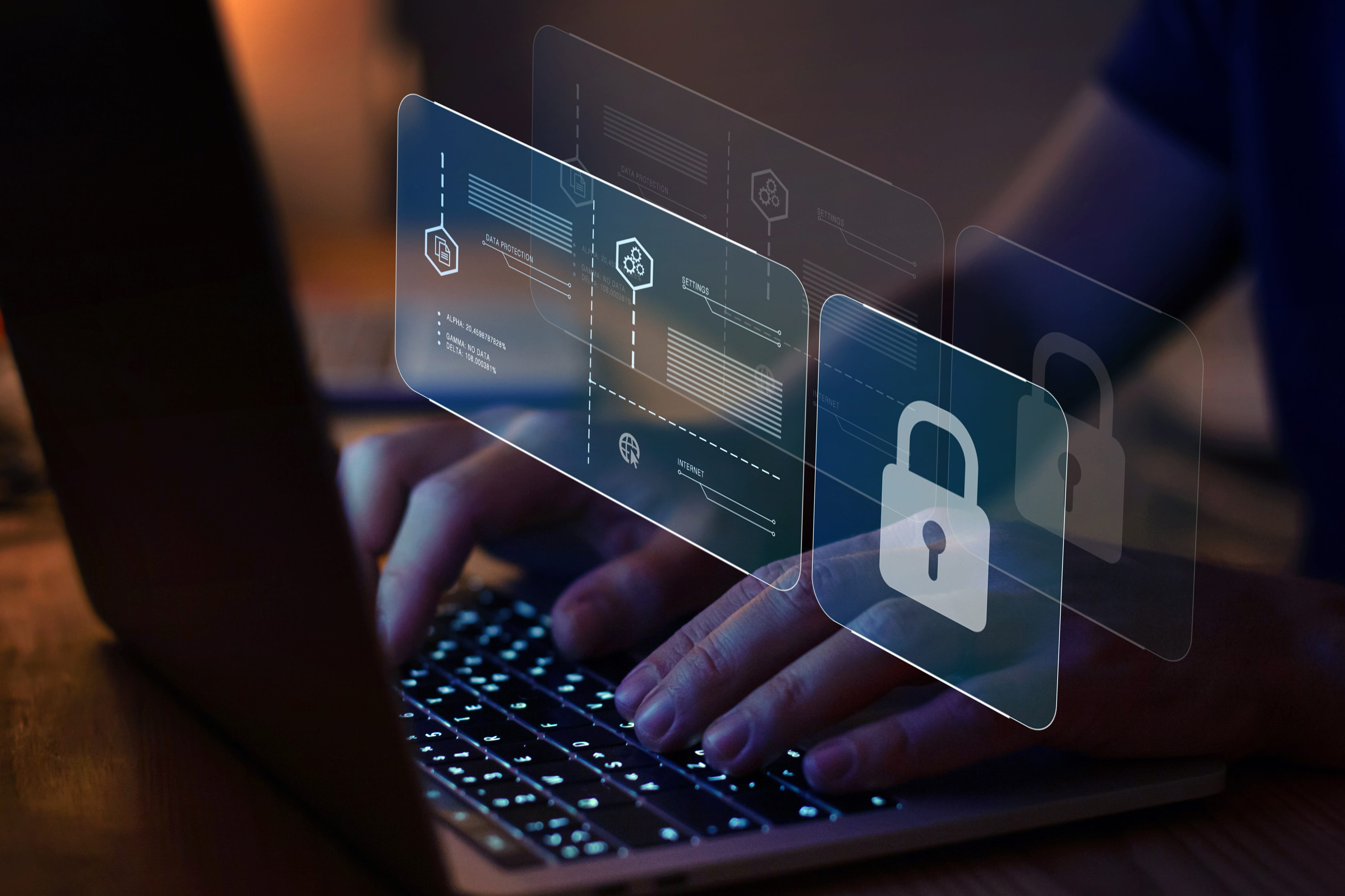 Hands typing on a laptop with an internet security screen featuring a padlock icon projected over them