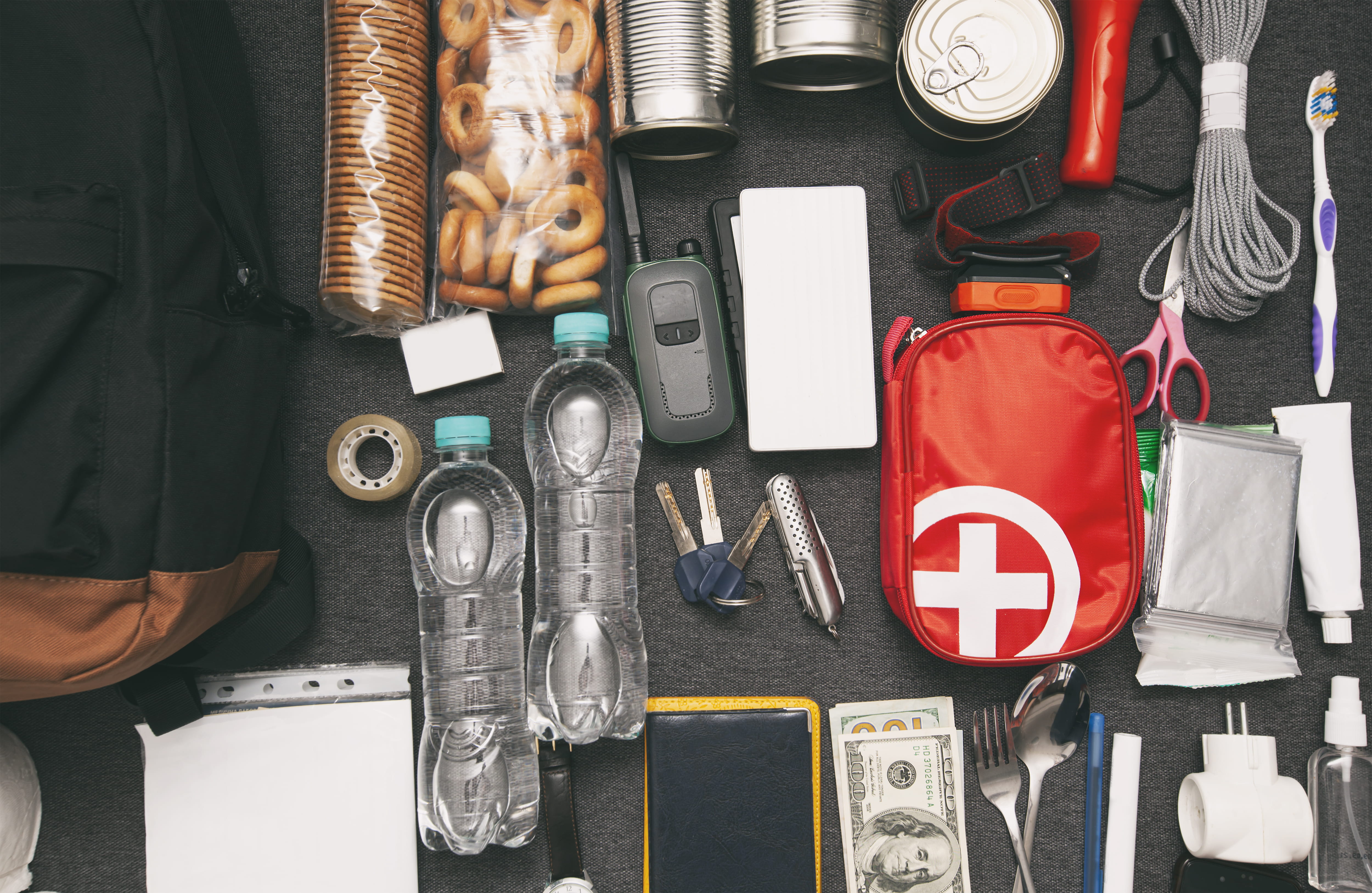 Items that would be in an emergency kit, neatly laid out.