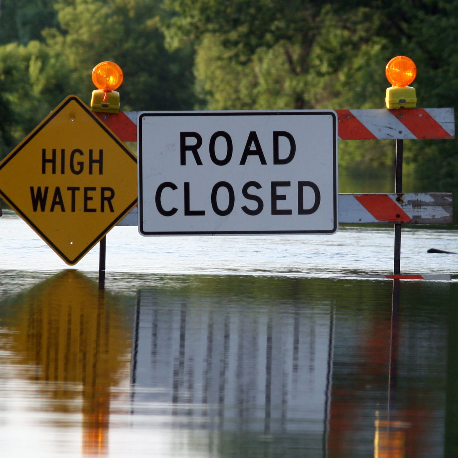 Road closed and high water signs