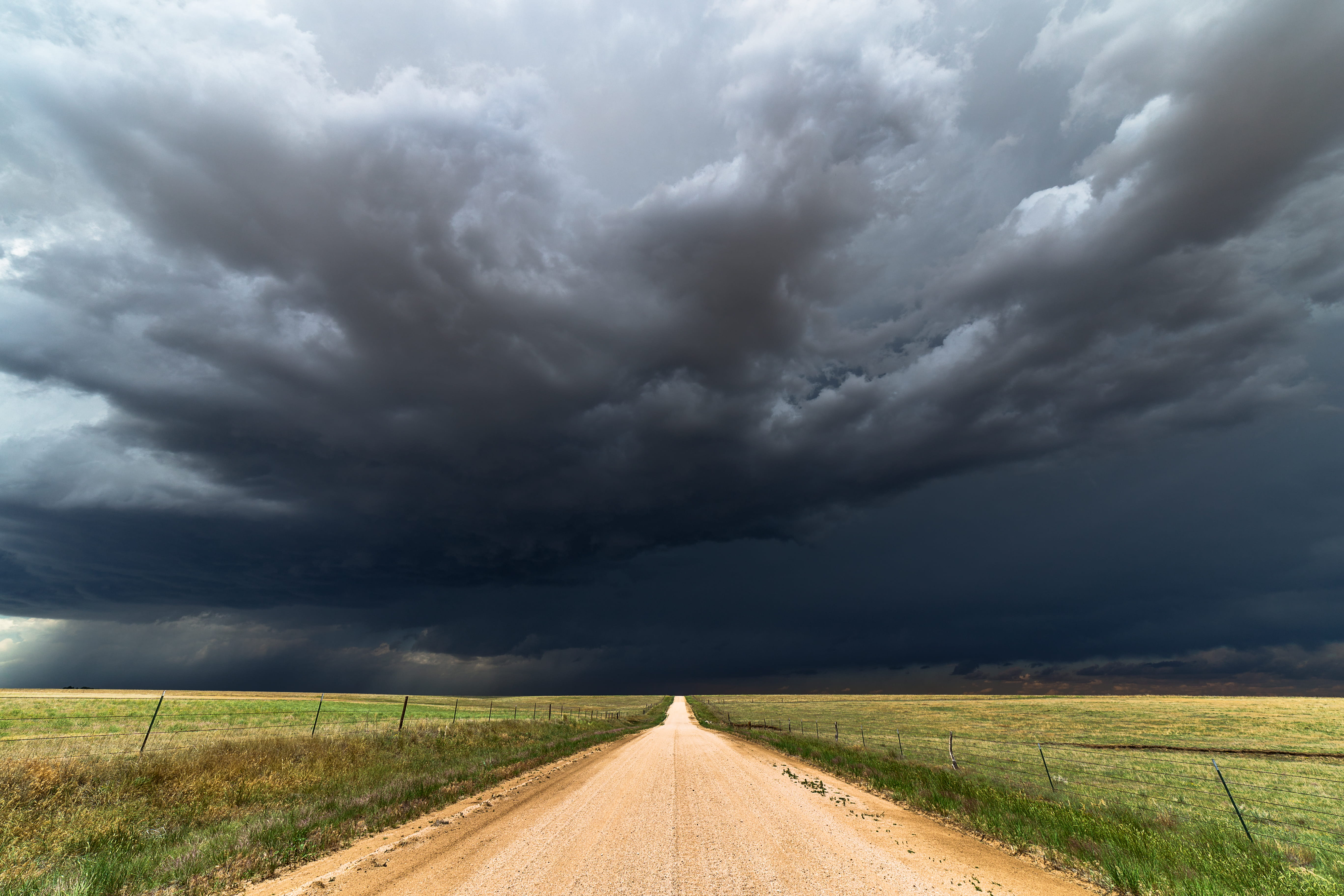 Dark sky over dirt road