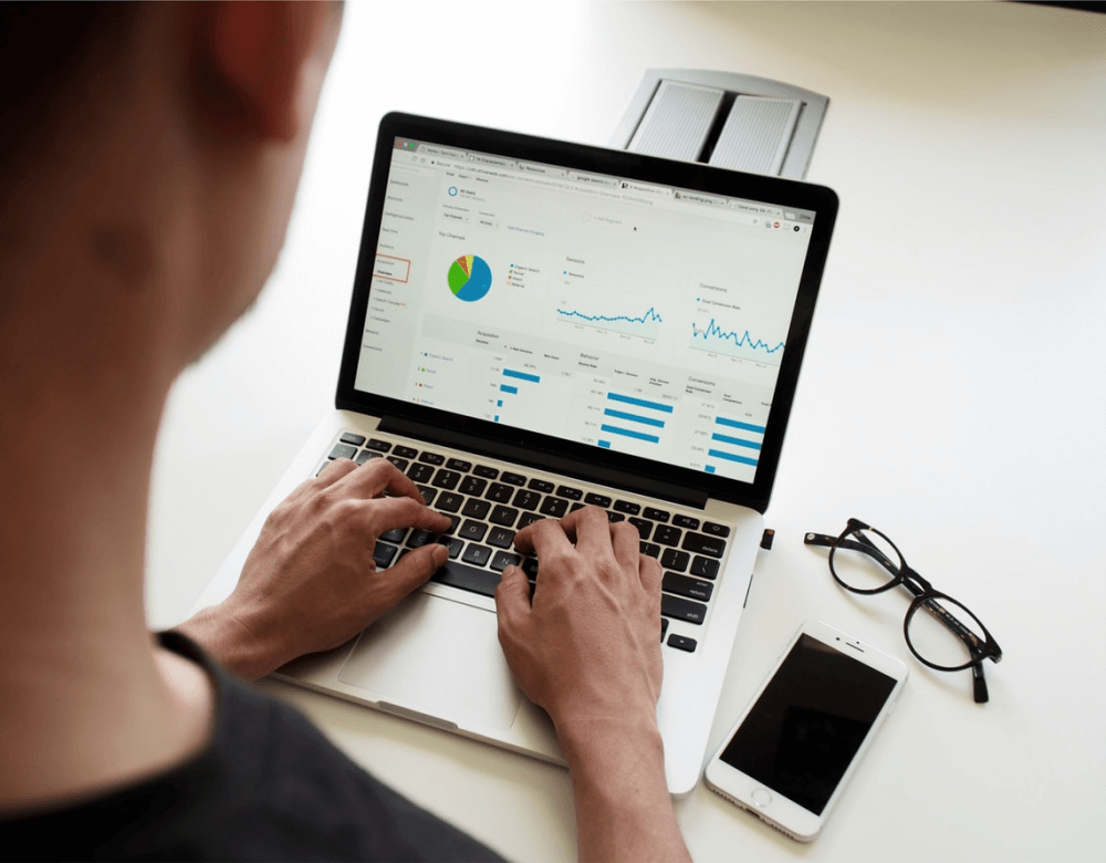 Someone looking a data on a computer.