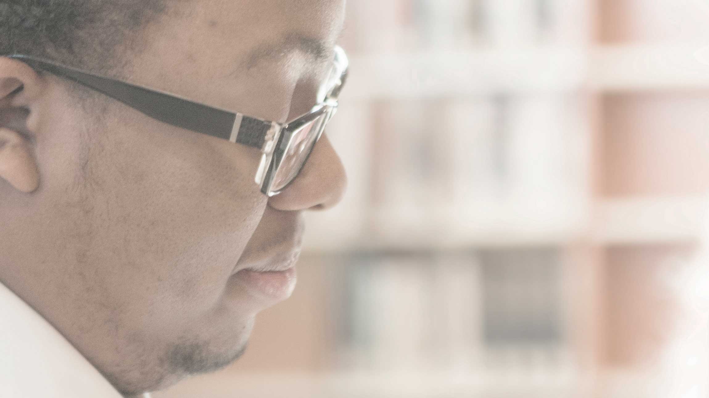 Side view of man wearing glasses