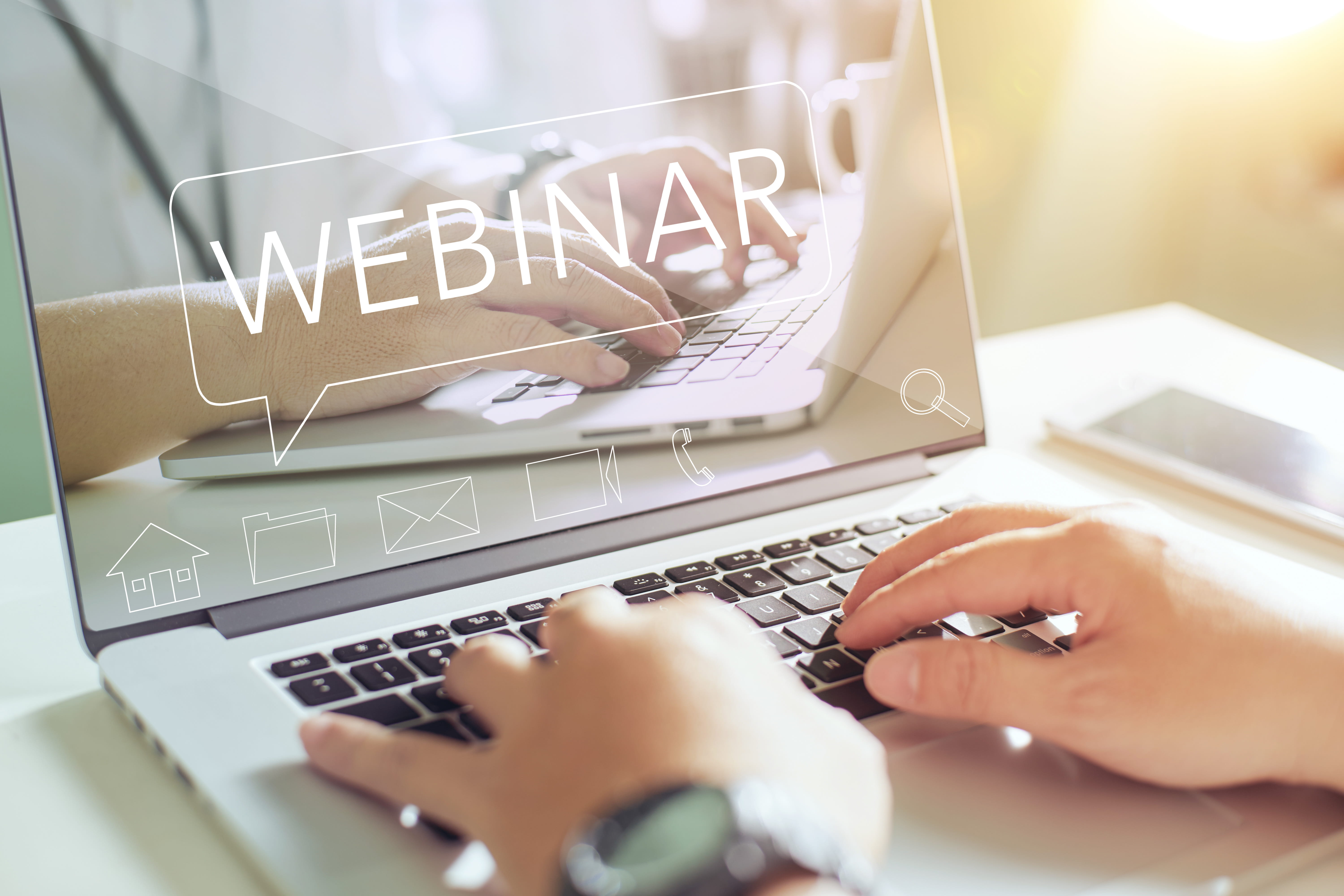 a laptop screen with Webinar appearing in text
