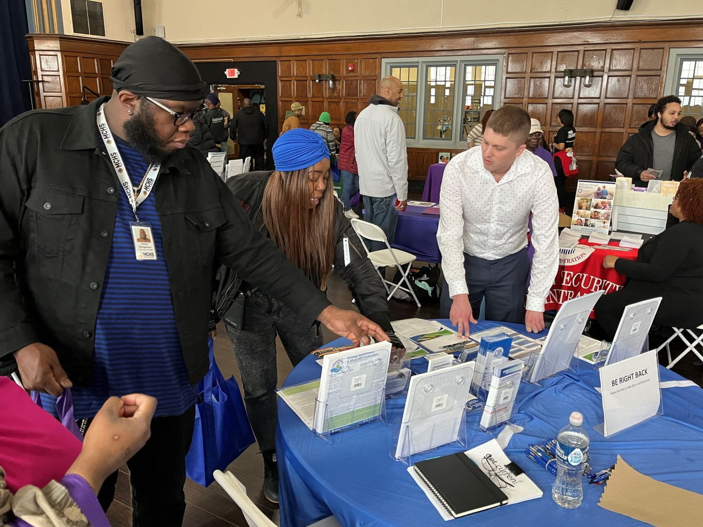 MPSC worker discusses savings opportunities with members of the public