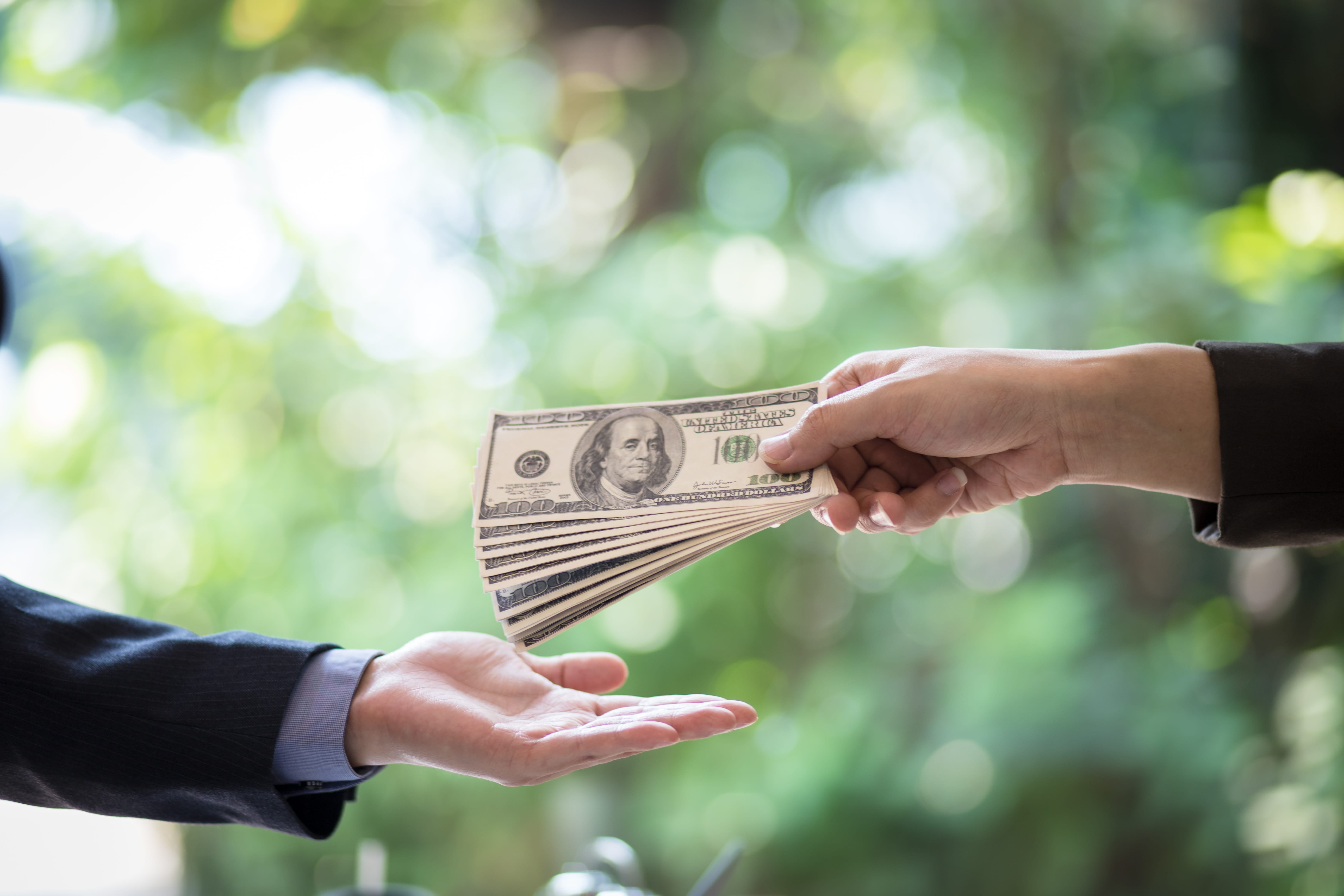 Handing money over to another person