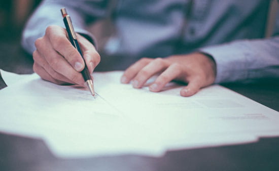 Person Writing Report