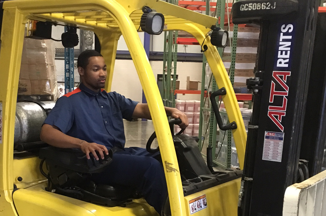 Man operating a fork lift