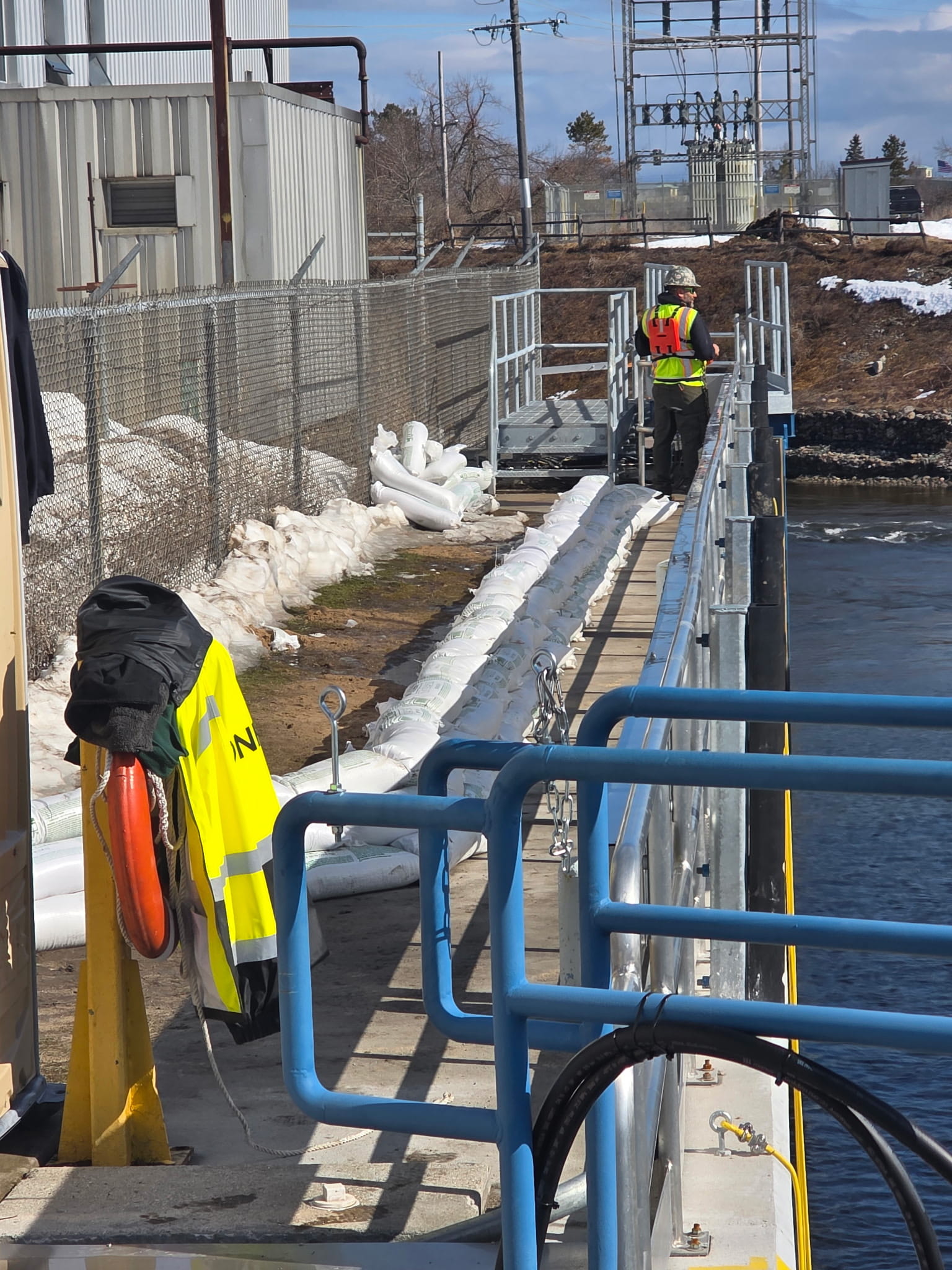 Sand bags lined up along the dam.