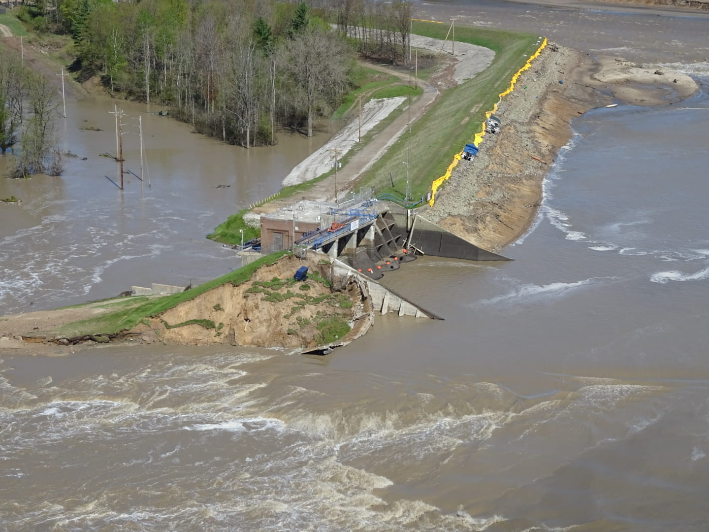 An aerial view of a broken dam. 