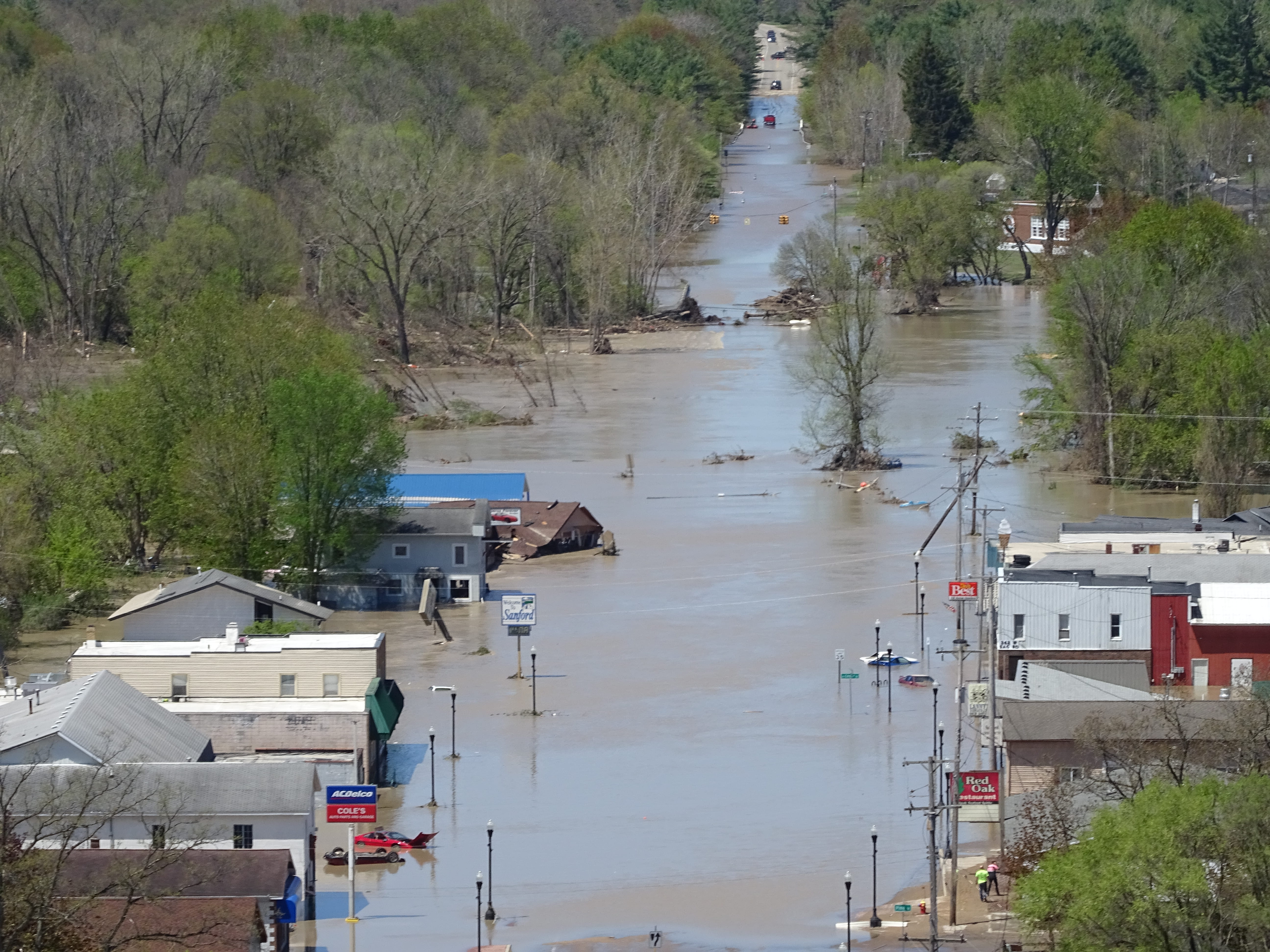 An aerial view of a flooded town.