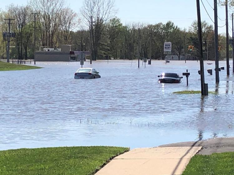 Cars surrounded by flood water. 