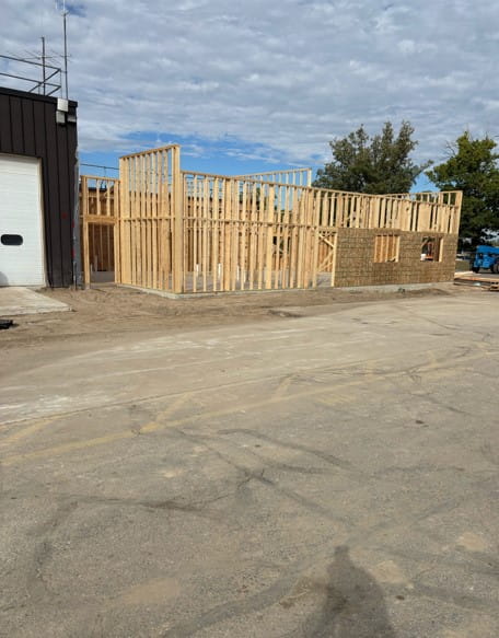 Framing for a new part of the building next to the current building.