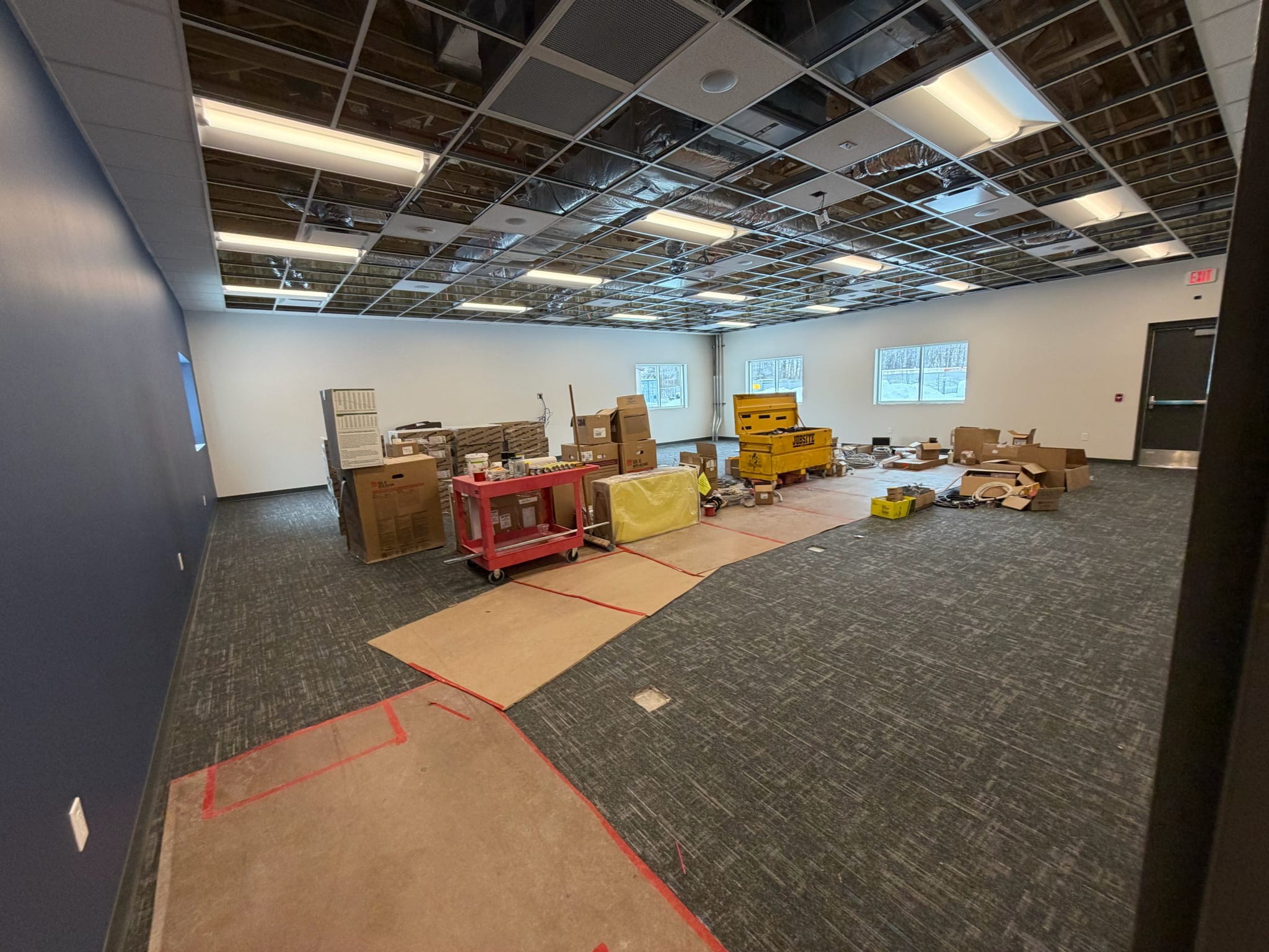 A classroom with finished walls and new carpet.