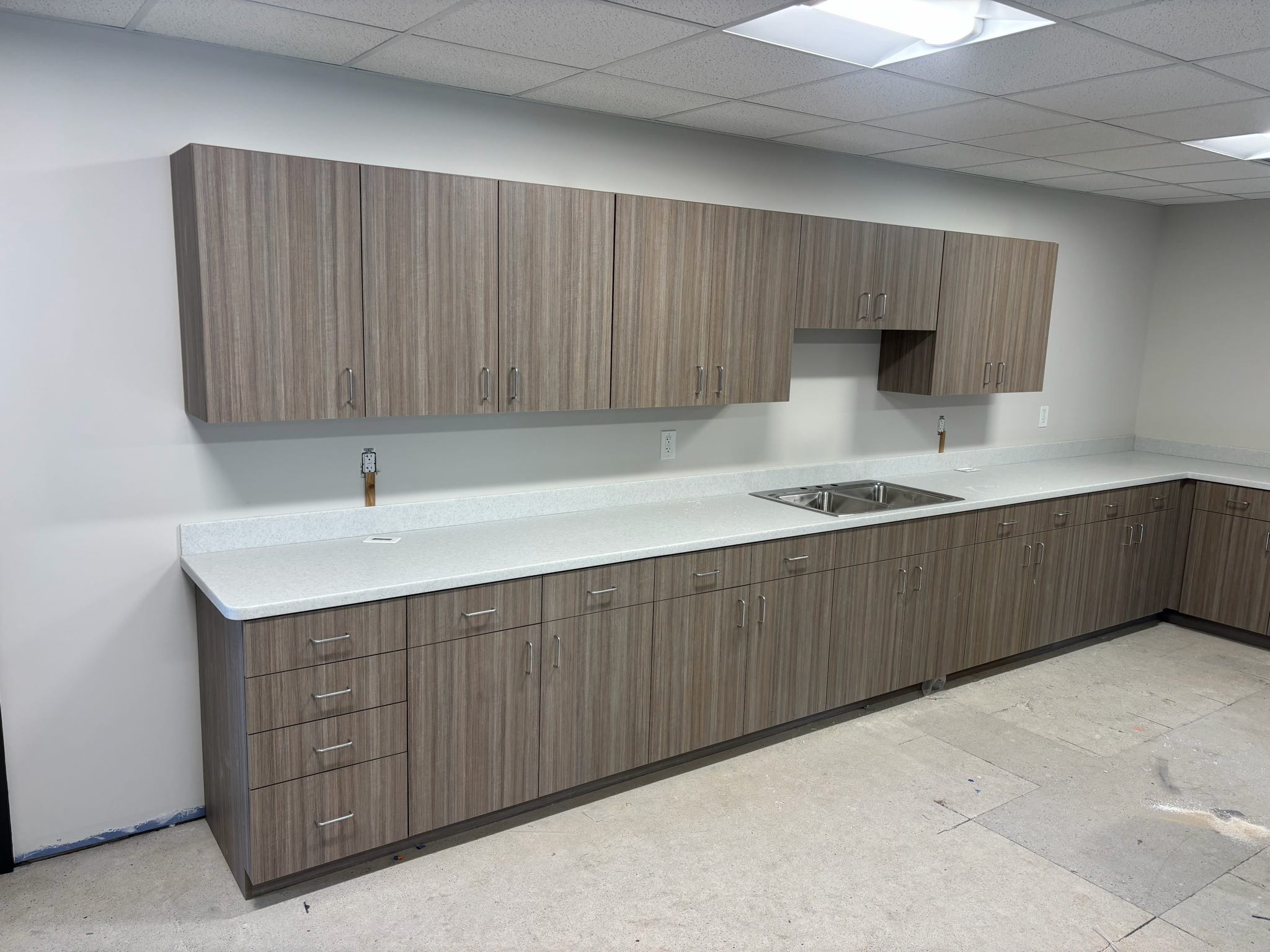 A newly installed kitchen counter and cabinets.