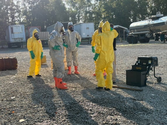 People in hazmat suits training