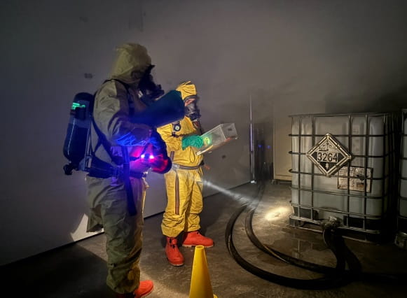 People in hazmat suits