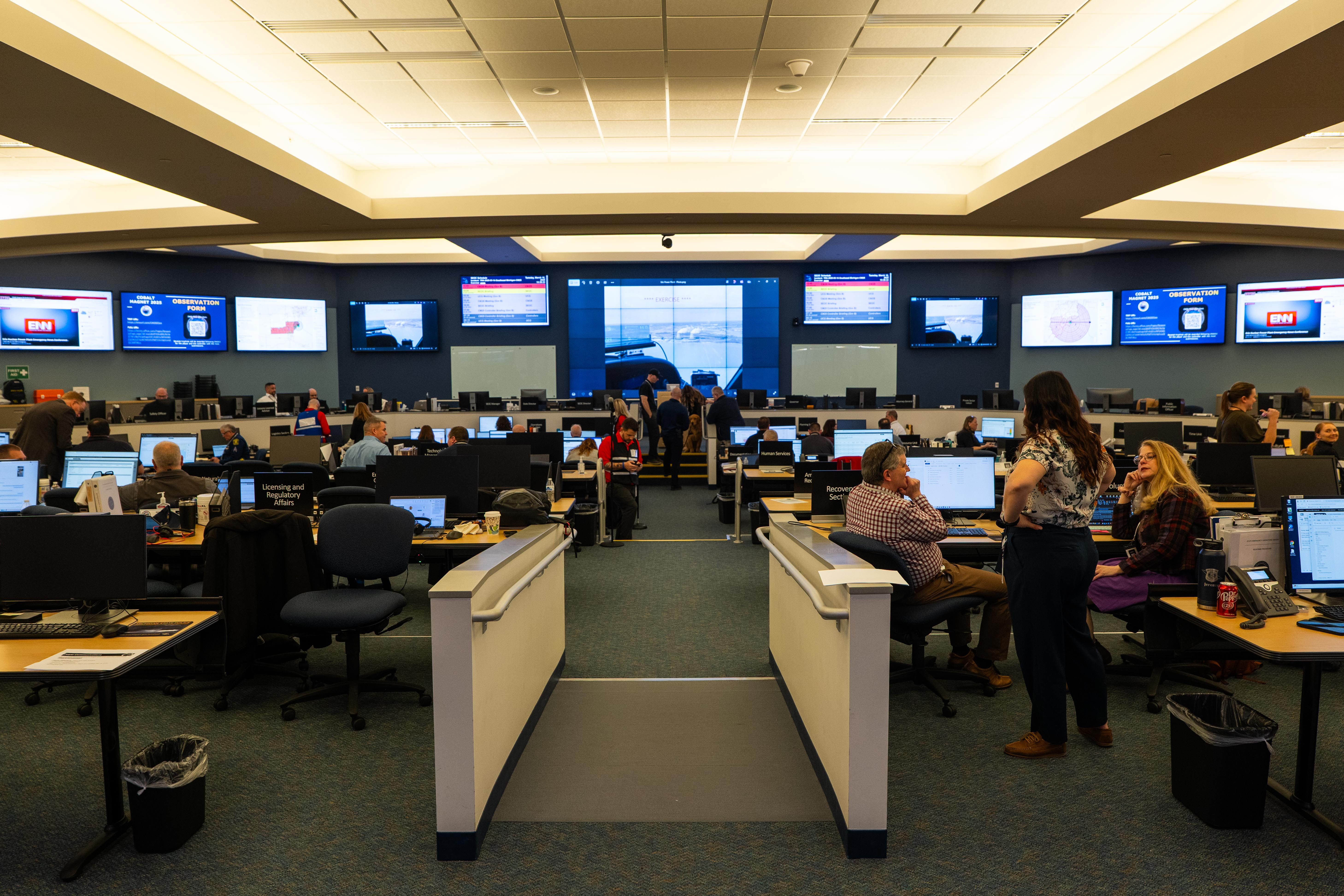 People working in the State Emergency Operations Center.