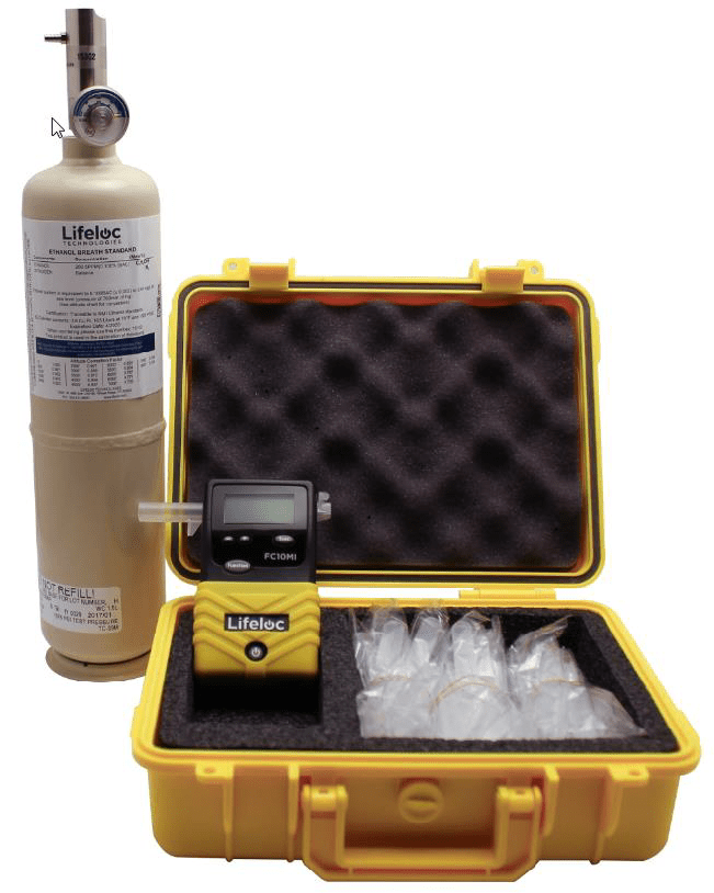 Yellow Lifeloc instrument with carrying case and gas canister. 