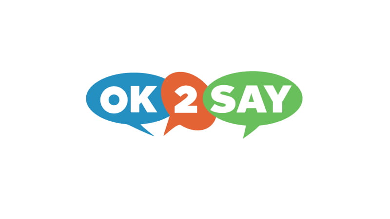 OK2SAY logo with blue, orange, and green speech bubbles. Stop the Silence. Help end the Violence. 