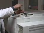 Trace scientist analyzing fire debris evidence