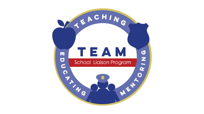 TEAM logo, blue circle with blue figures of police officer and people. 