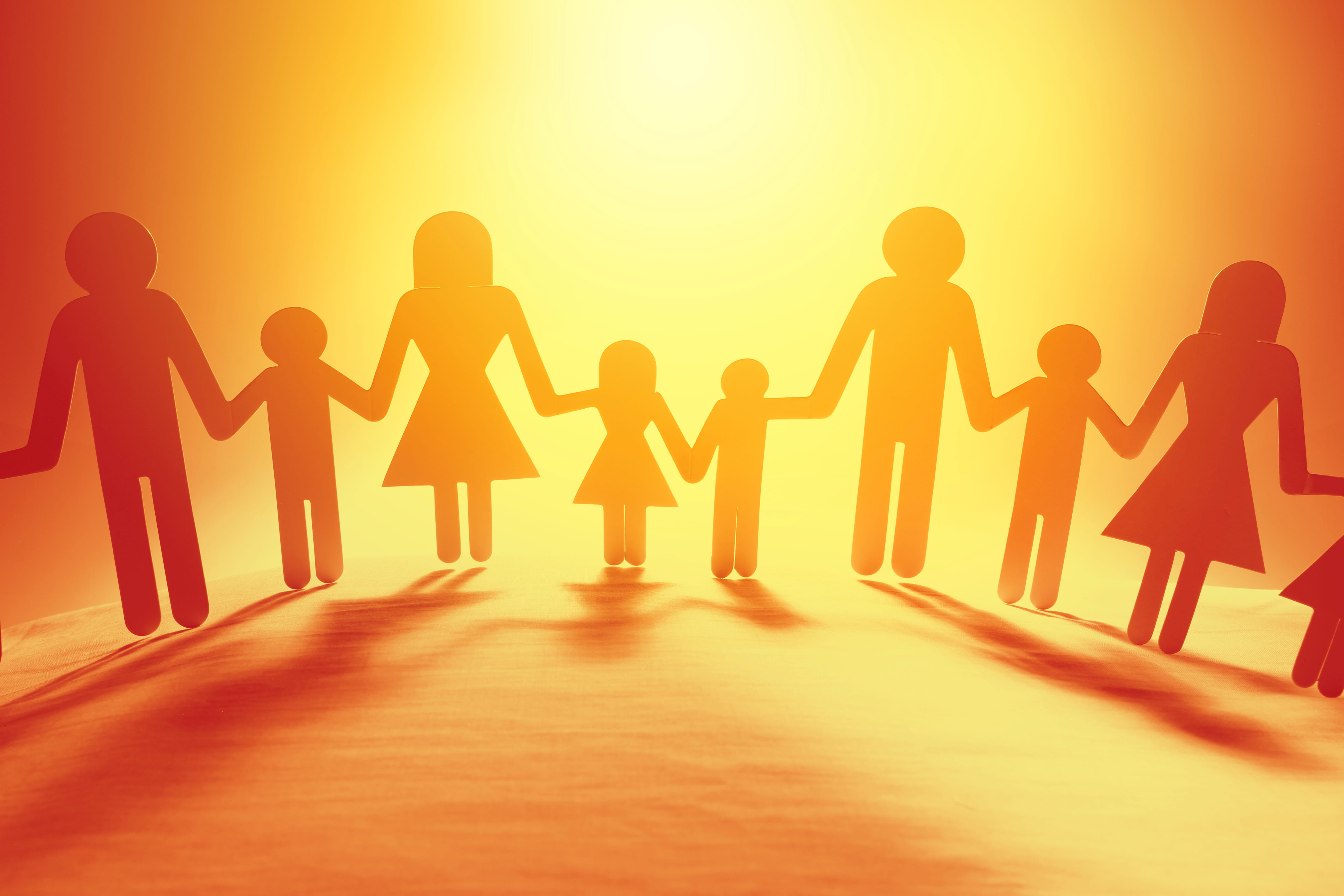 Cutouts of students and families holding hands. 