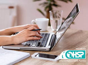 person typing on a laptop