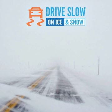 blowing snow across a road