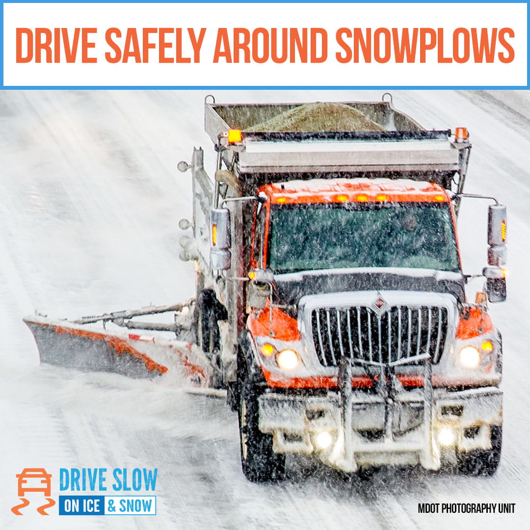 snowplow plowing the road