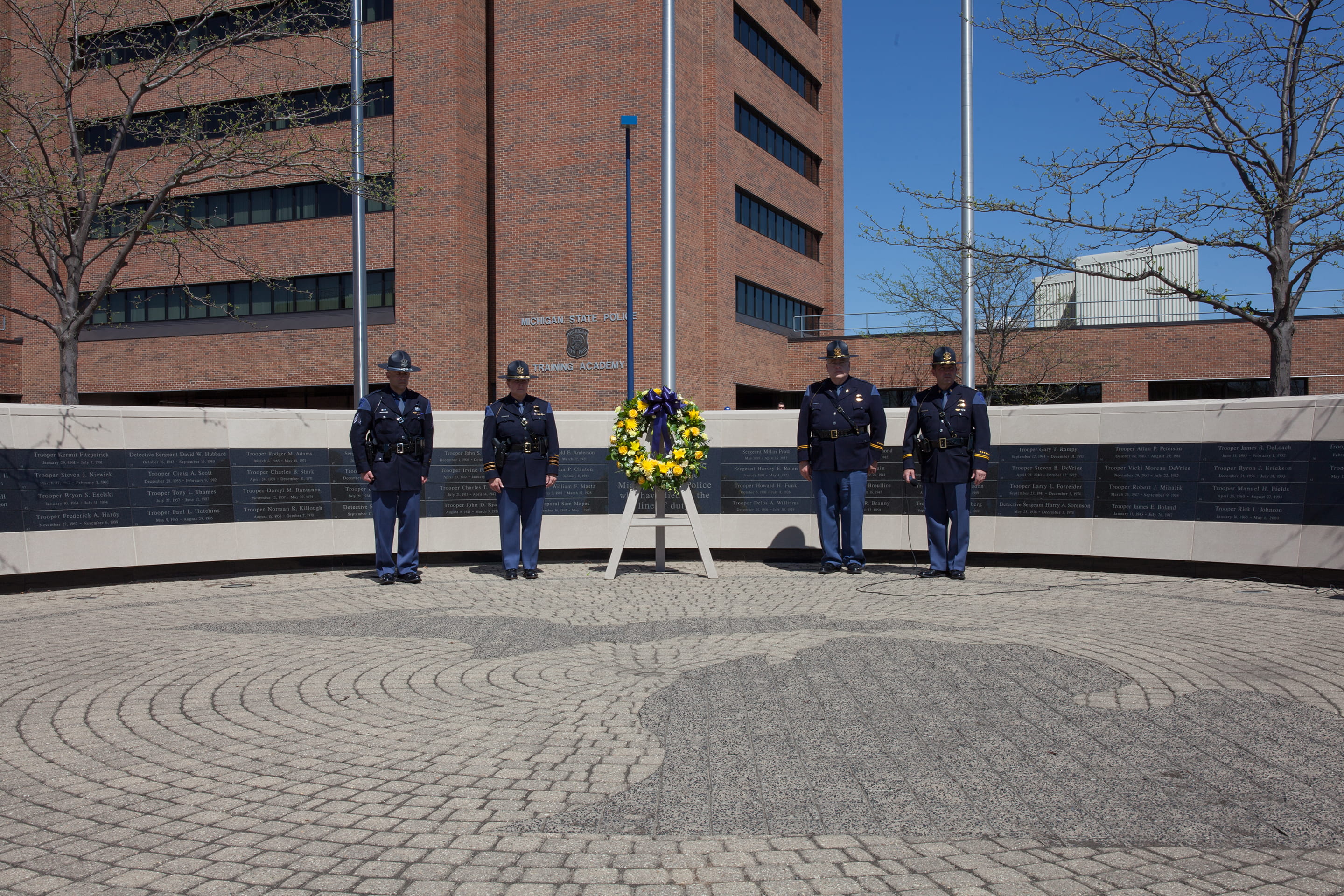 Four troopers standing at the Fallen Trooper Memorial