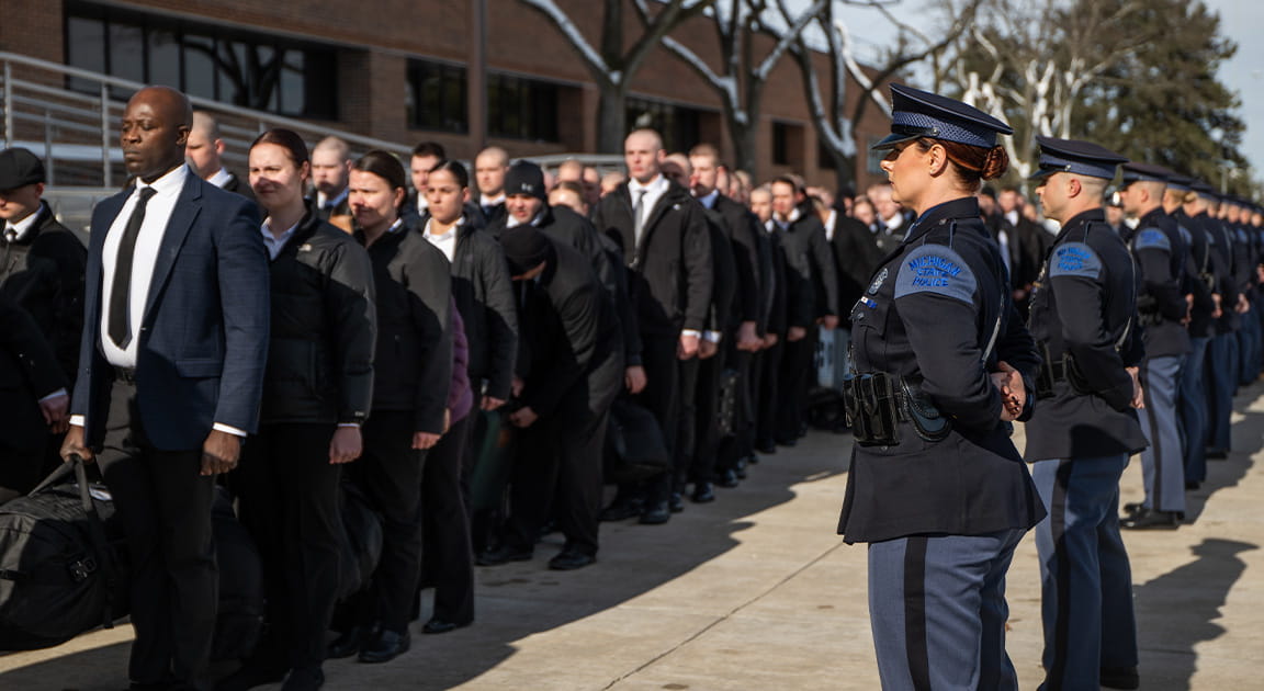 Recruit line up outside the Training Academy on the first day of recruit school. 