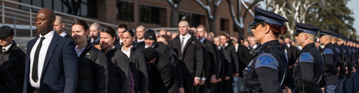 Recruit line up outside the Training Academy on the first day of recruit school. 