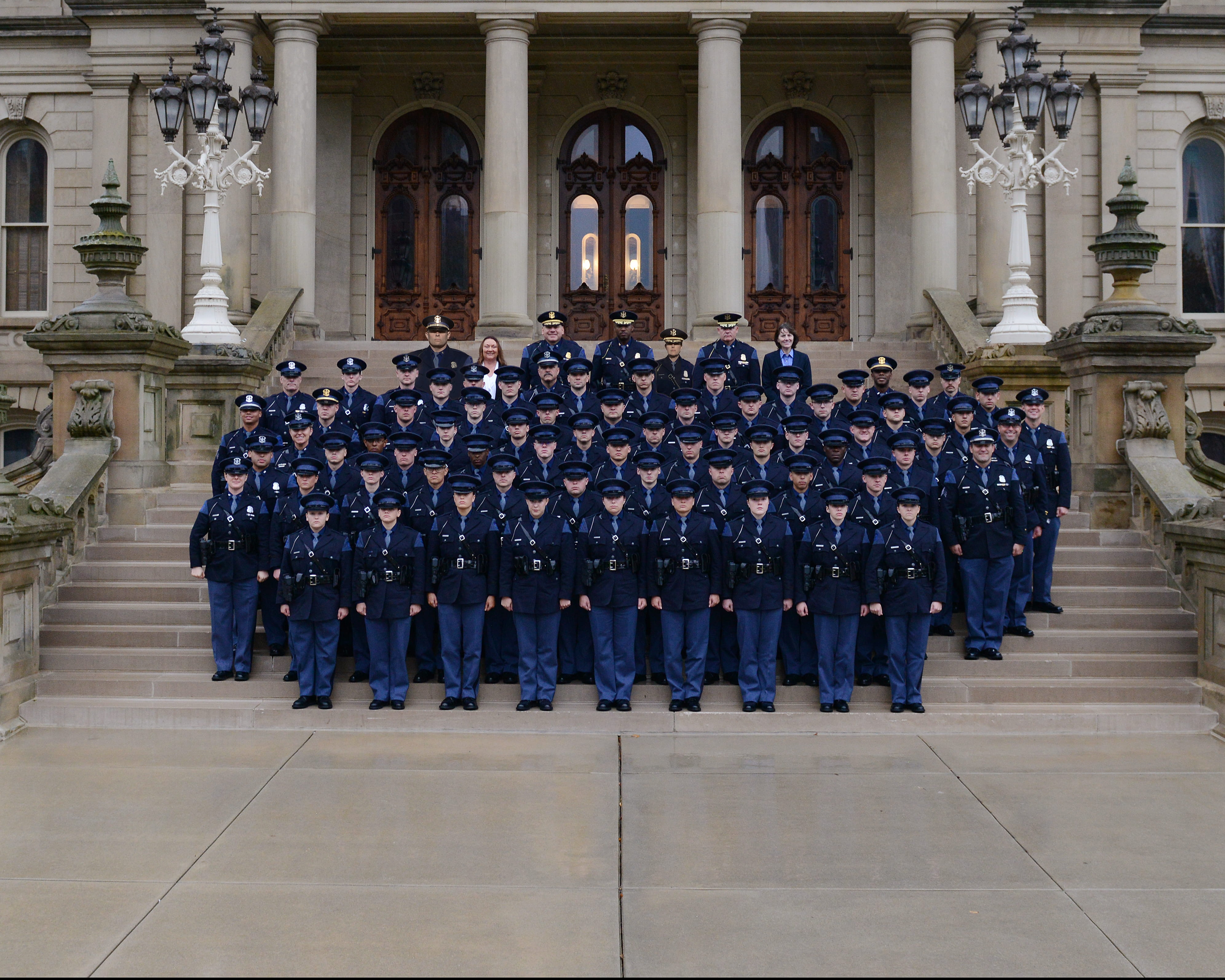 Group of troopers in uniform standing on the Capitol steps