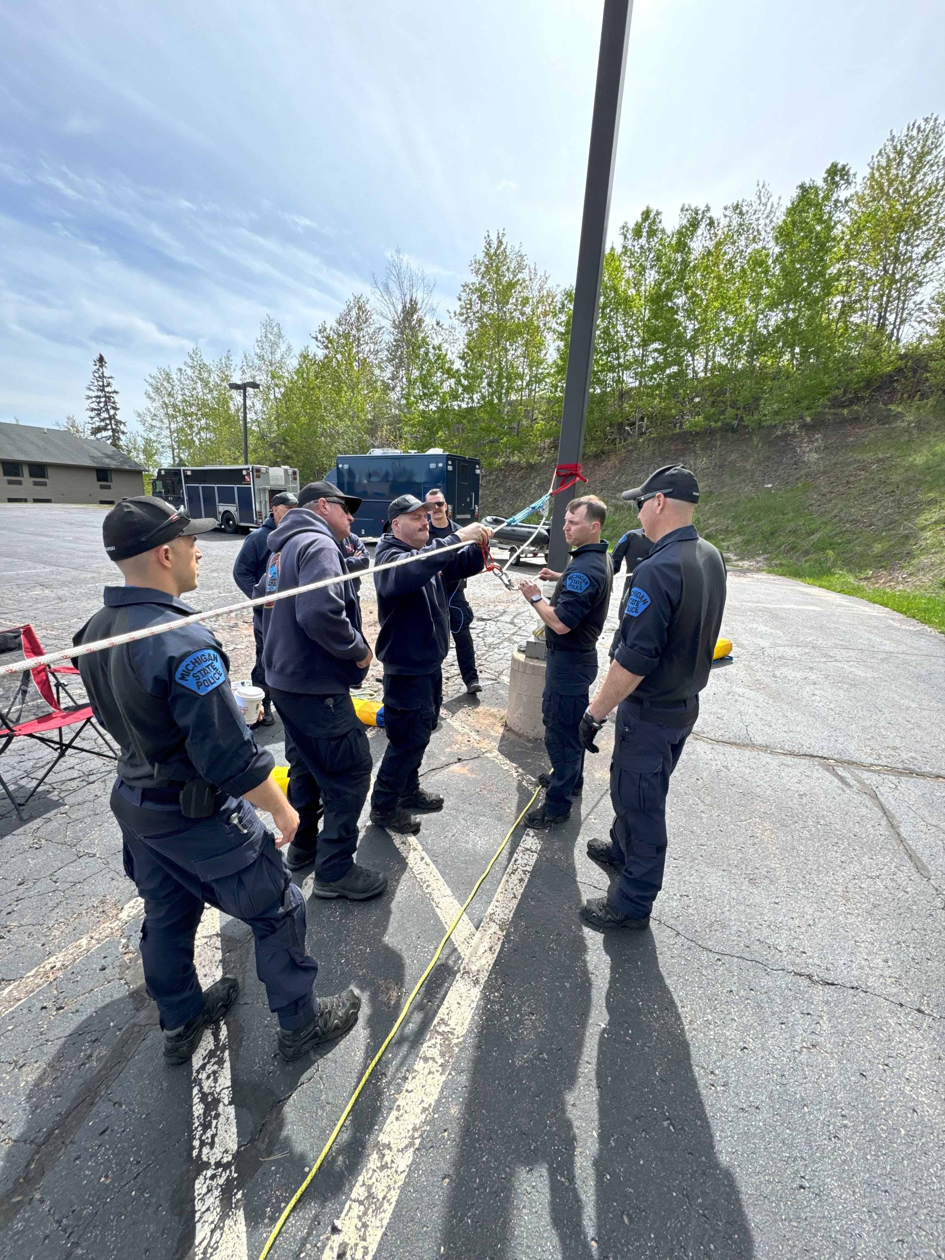 MSP Marine Services Team members working on land with rope systems
