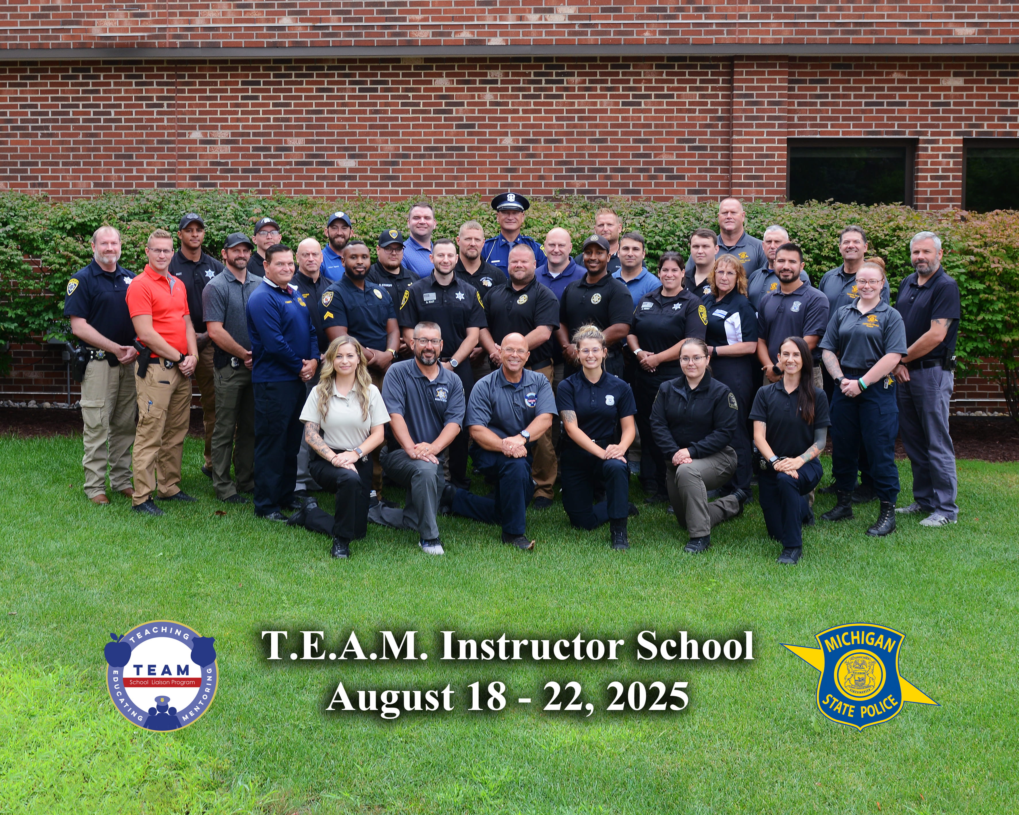 TEAM School Liaison Program graduates outside for a group photo with instructors