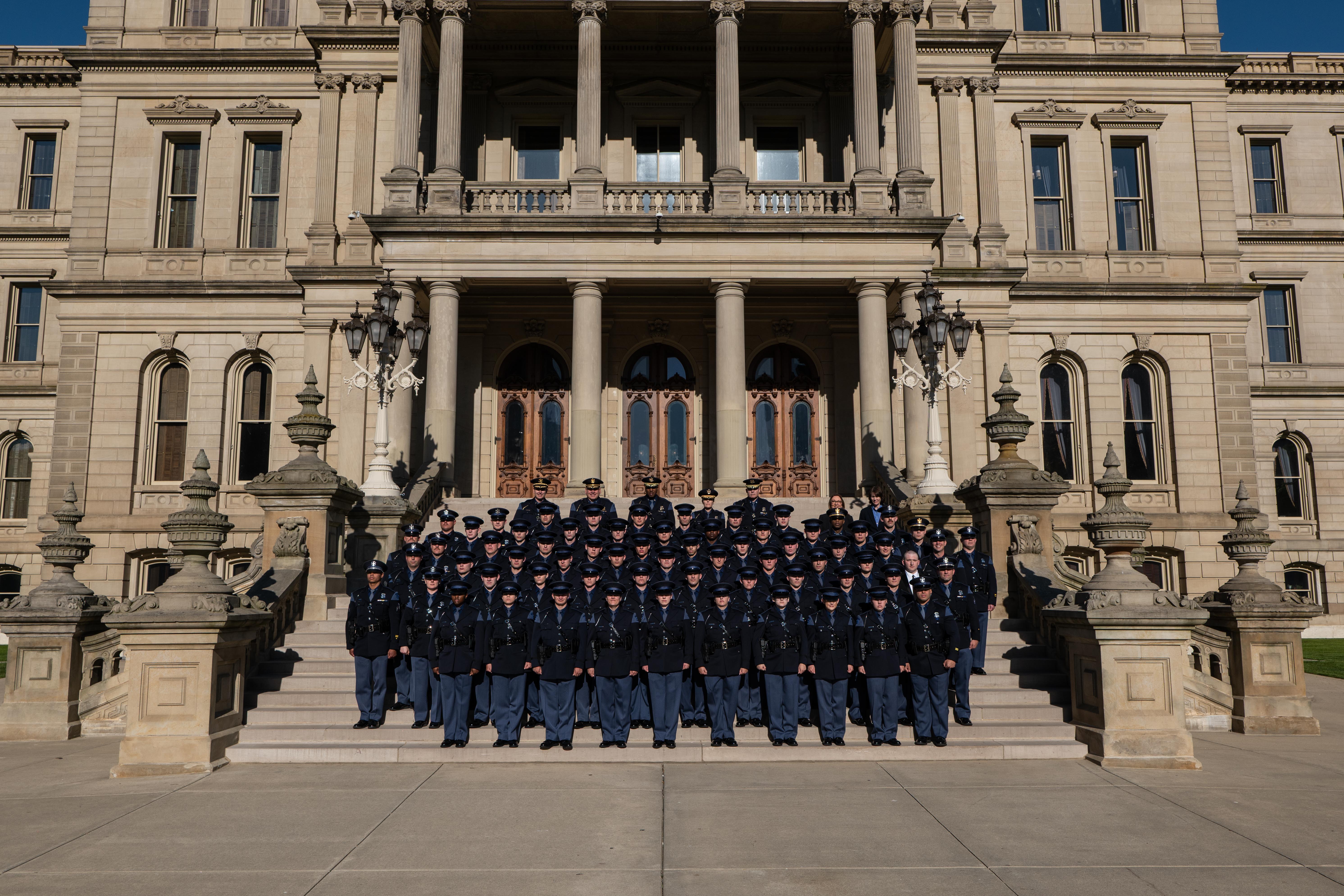 148th Trooper Recruit School class and command standing on the Capitol steps in Lansing