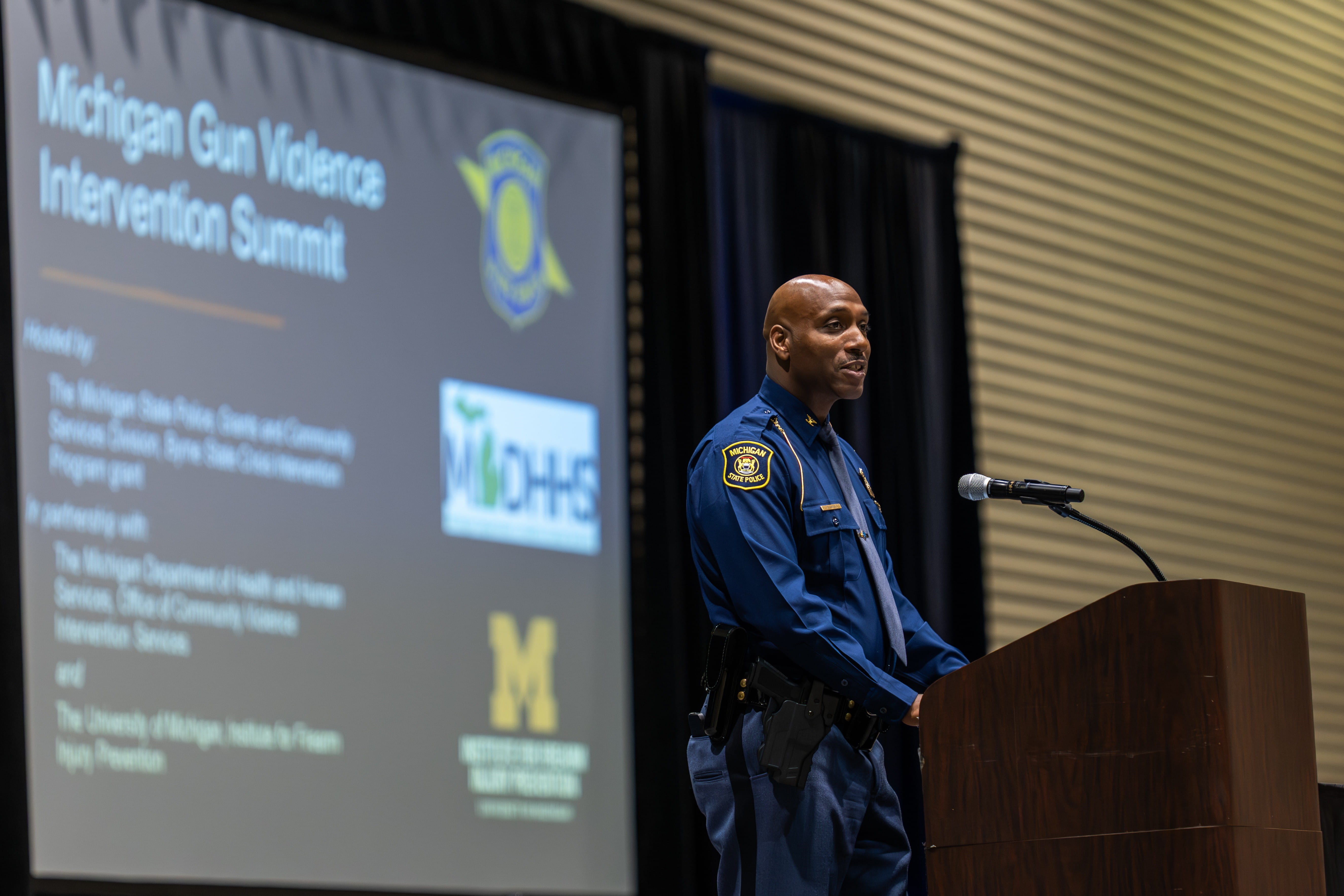 Col. James F. Grady II speaking to attendees at the Gun Violence Intervention Summit