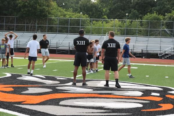 Photo of Lieutenant Tedric Gibbs coaching football