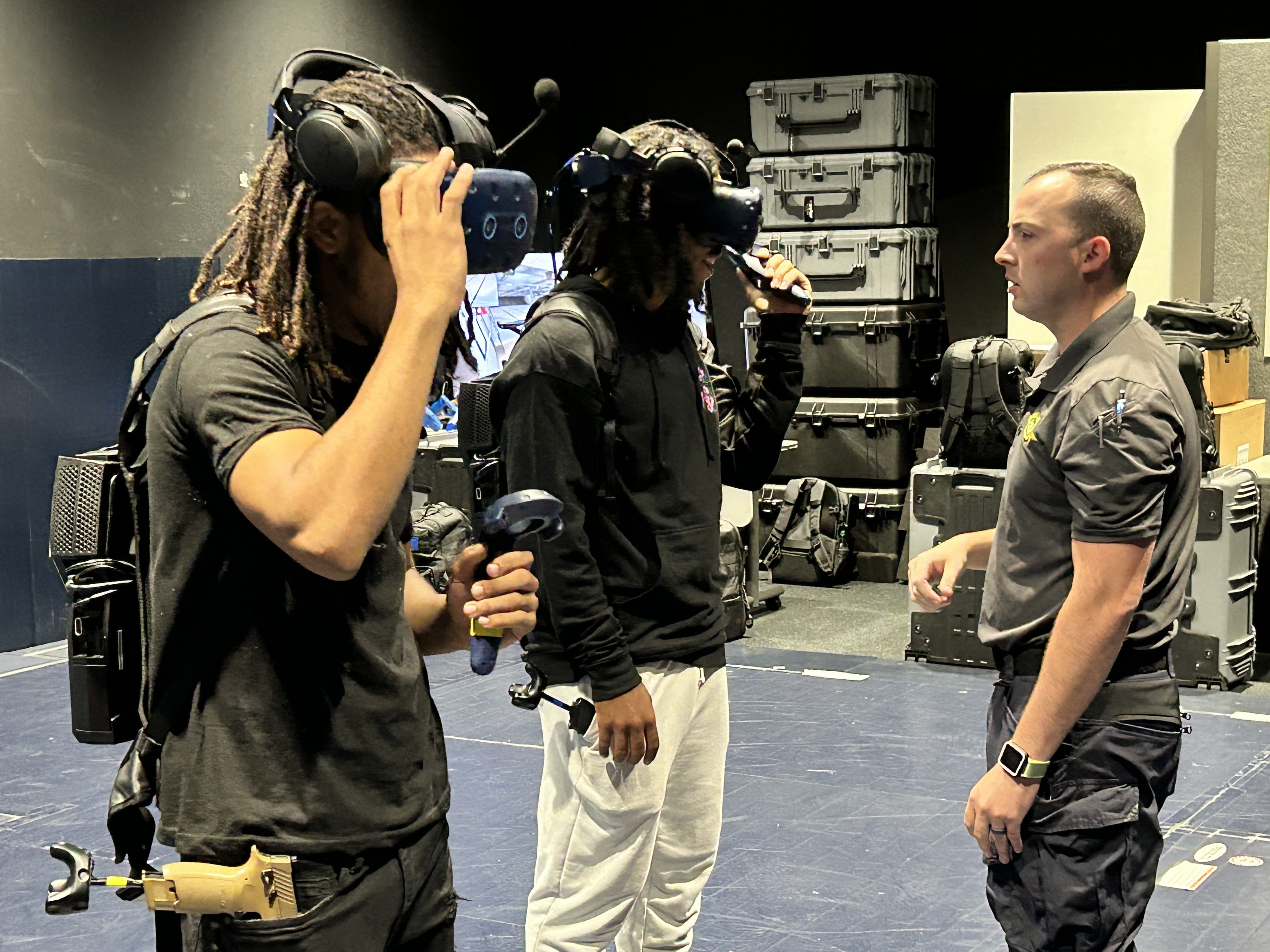 Demontray Horton, and Devon Horton undergo a virtual reality simulation at the Training Academy during a facility tour