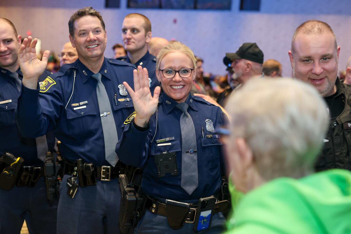 Community service troopers giving hive five to athletes