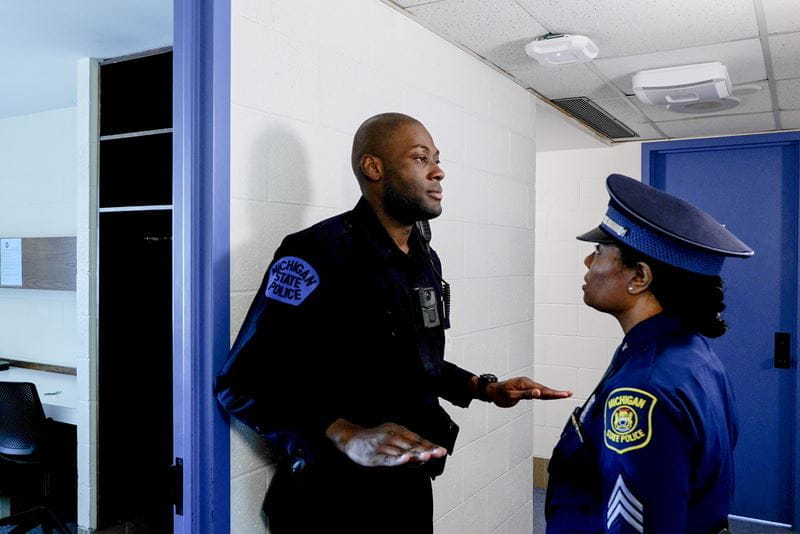 Photo of trooper recruit in doorway during inspection