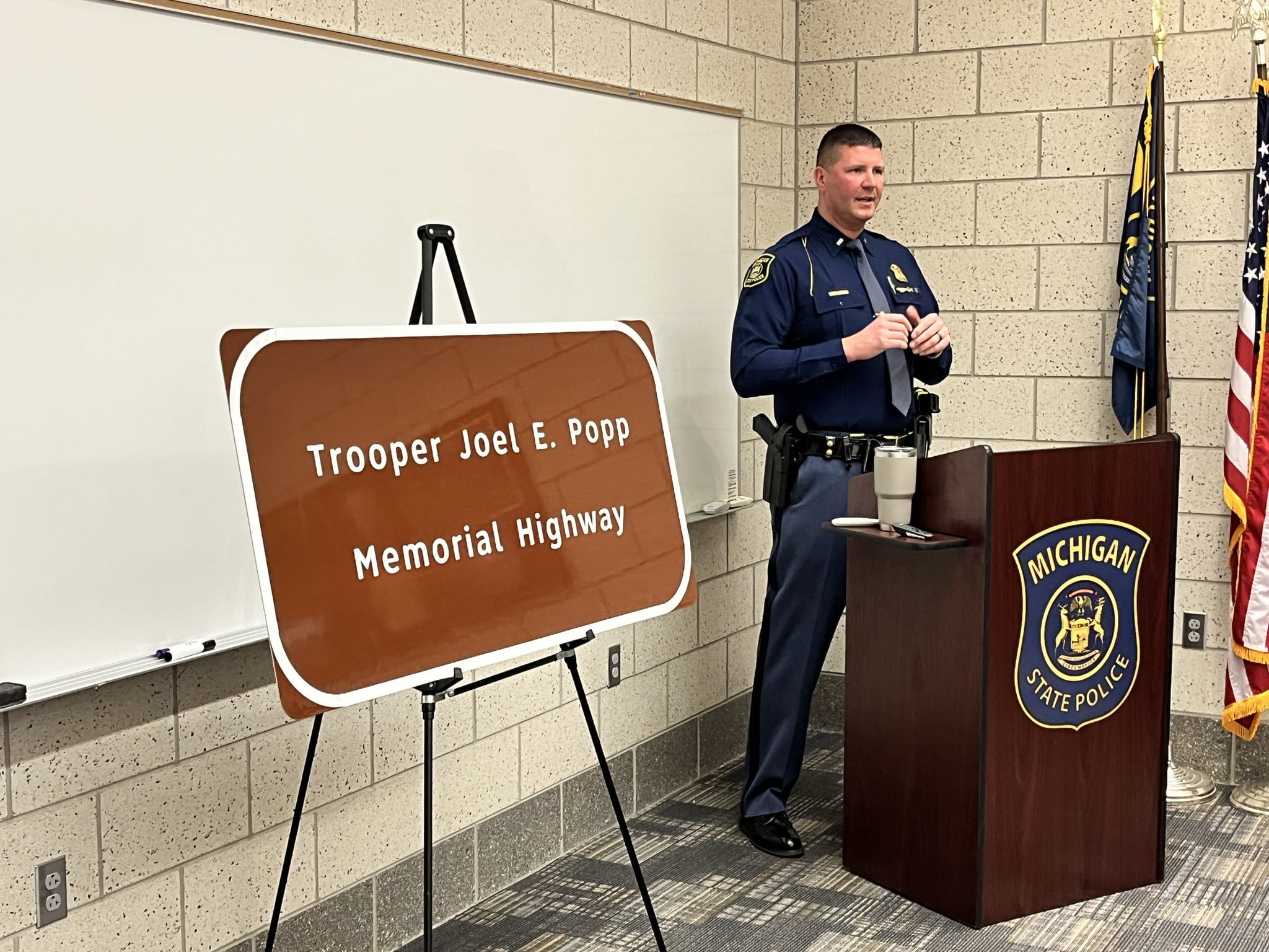 F/Lt. Dan Nease speaks during a memorial and roadside sign unveiling for fallen Tri-City Post Tpr. Joel E. Popp at the post in Freeland, April 2, 2025
