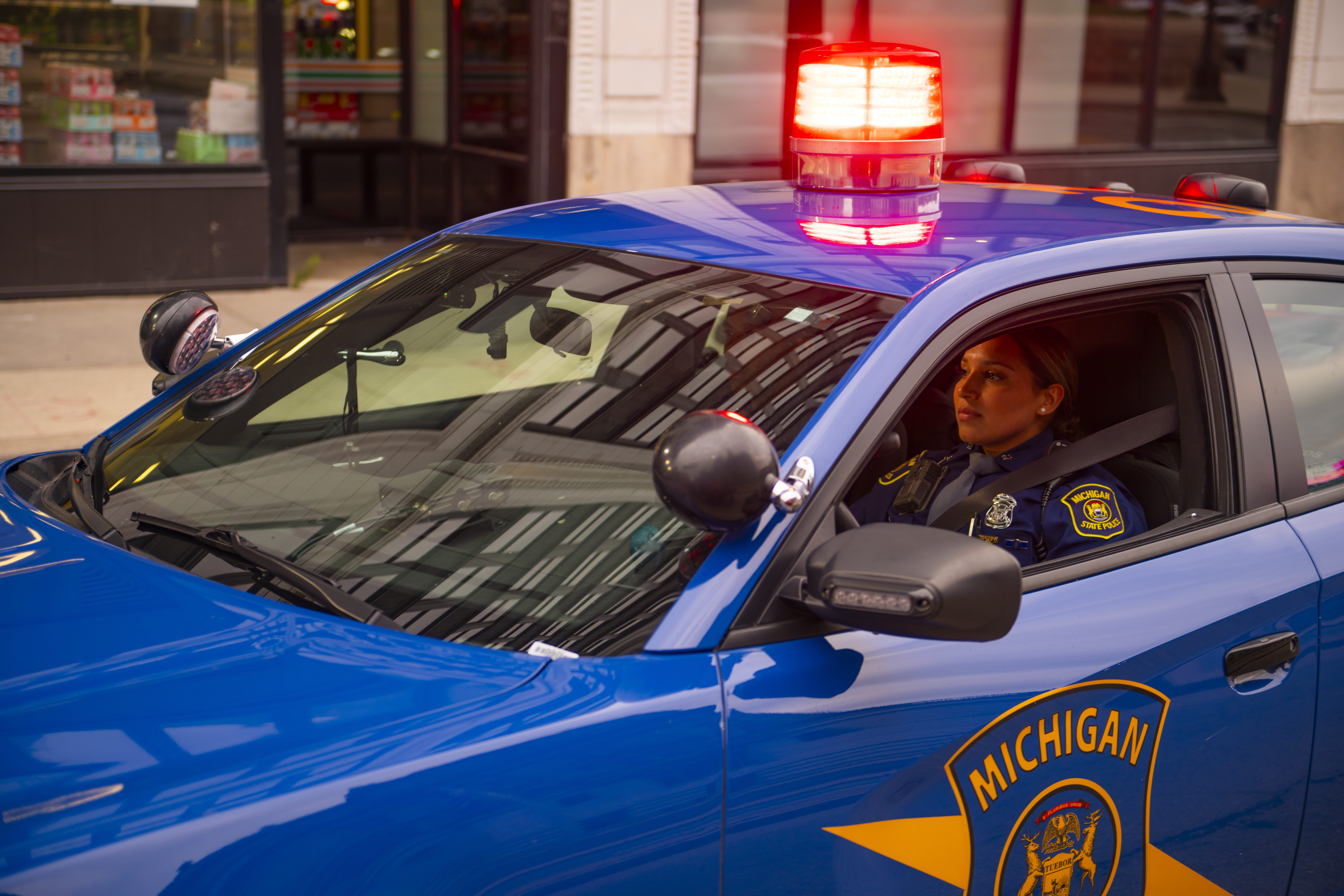 Trooper driving patrol car.