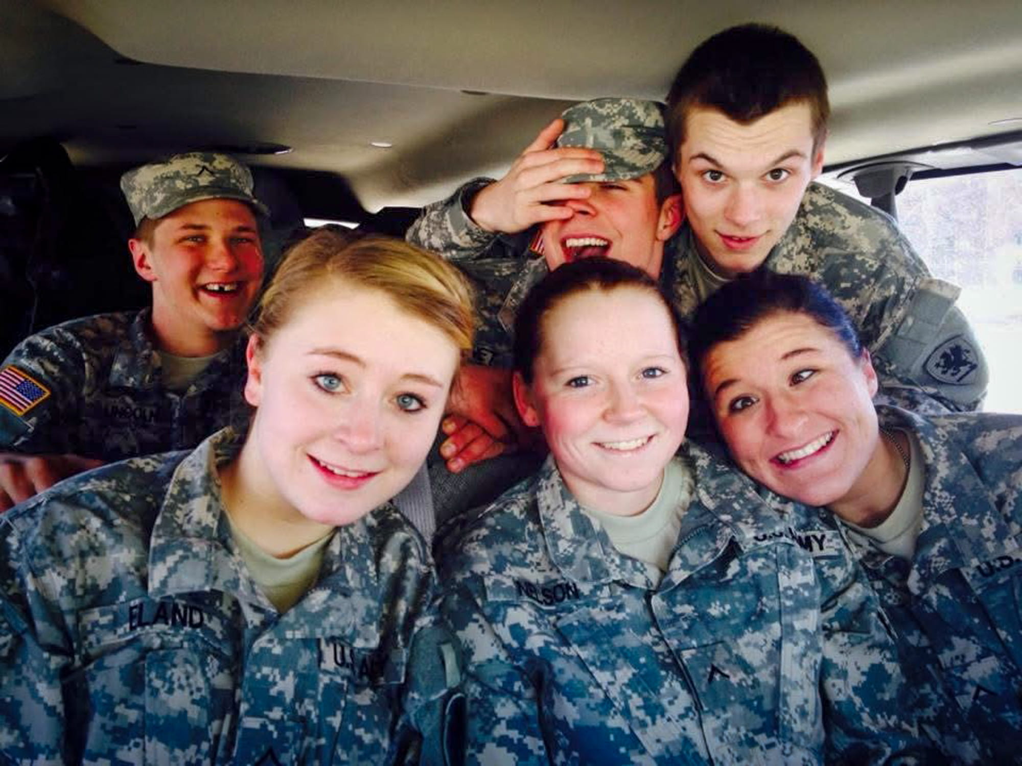 Alexis Nelson posing for a photo inside a vehicle with two males and two females