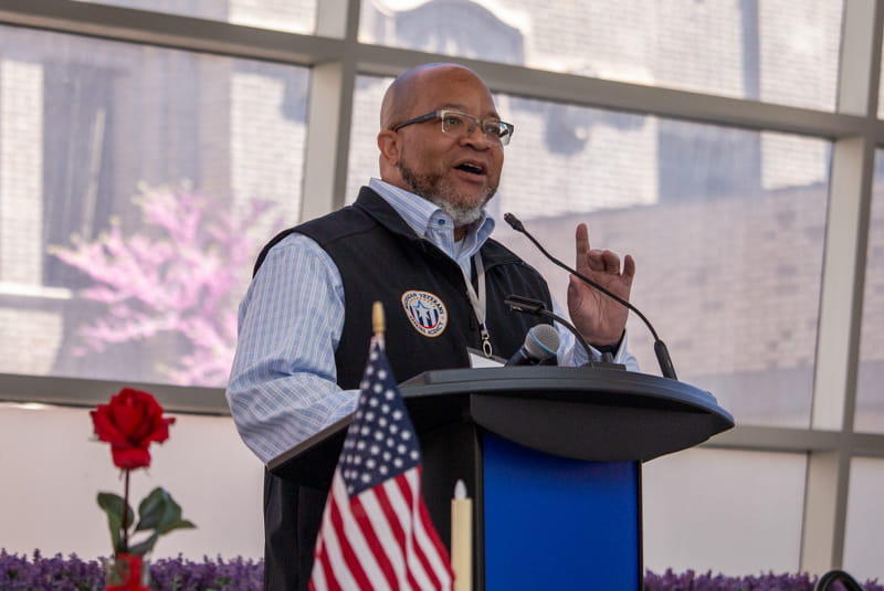 Director Brian L. Love speaking at the Leadership Summit