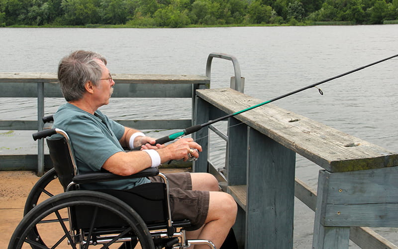 Person fishing off of a dock