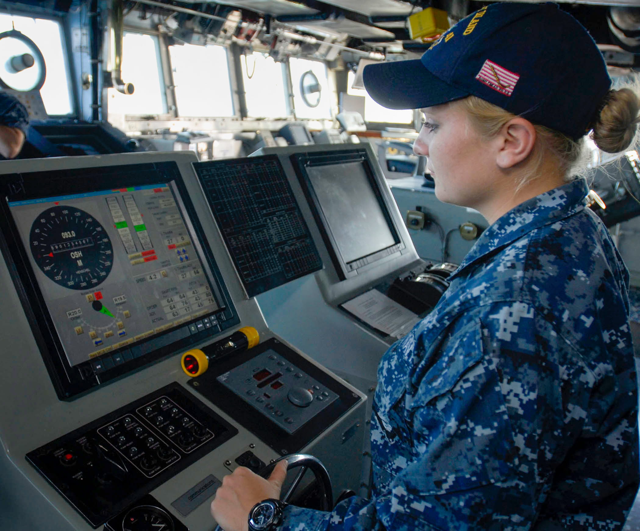 Seaman Chelsey Demick of Wyandotte mans the helm aboard amphibious dock landing ship USS Whidbey Island in the Gulf of Aden near Yemen in late 2011