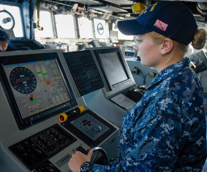 Seaman Chelsey Demick of Wyandotte mans the helm aboard amphibious dock landing ship USS Whidbey Island in the Gulf of Aden near Yemen in late 2011