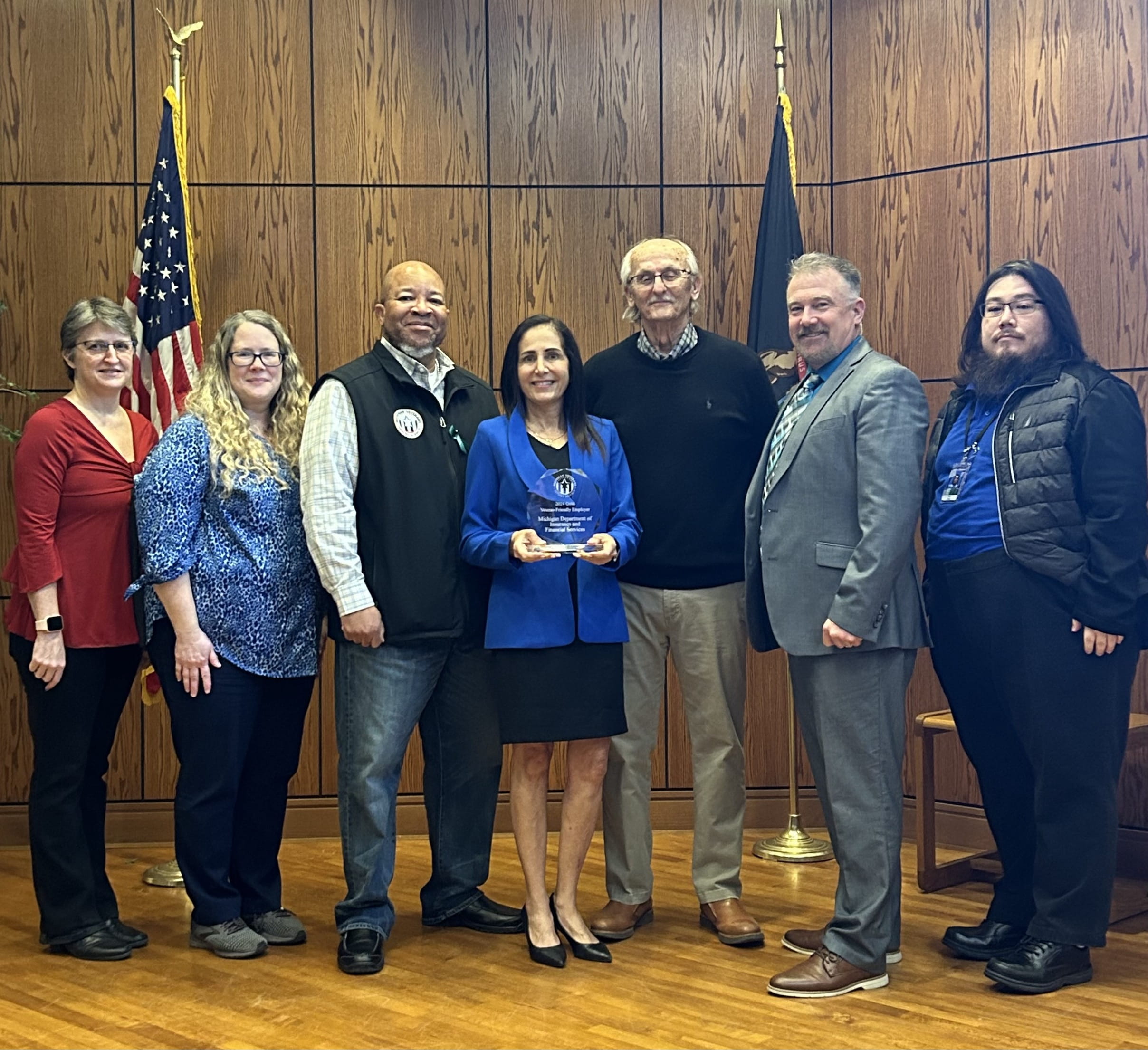 Michigan Veterans Affairs Agency Director Brian L. Love and Michigan Department of Insurance and Financial Services Director Anita Fox pose with DIFS Veteran Employee Resource Group.