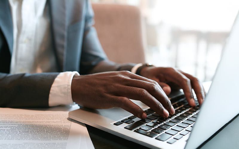 Man typing on laptop